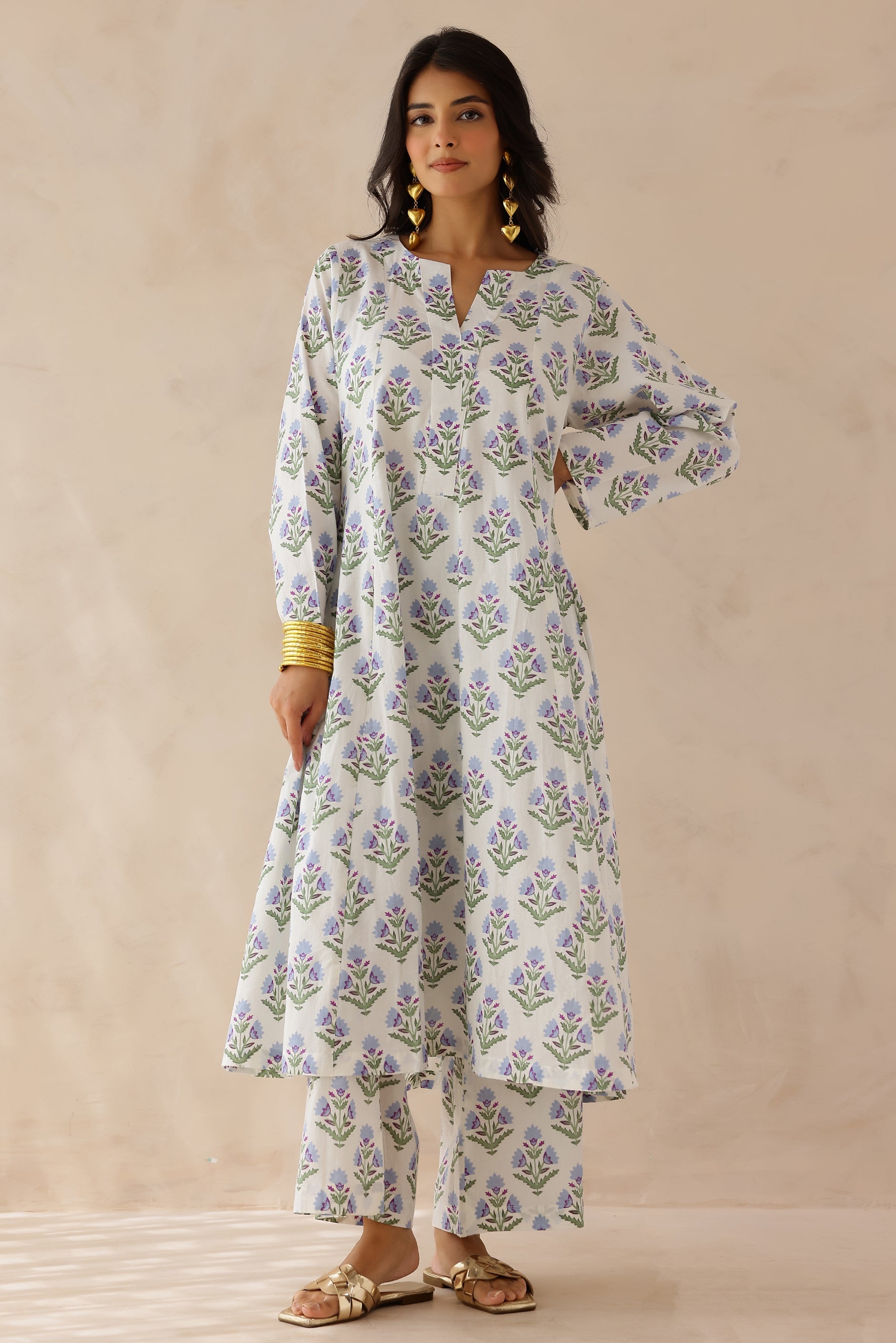 White Blue Printed Cotton Kurta with Palazzo Set of 2 for women featuring all over white and blue prints, round to V neckline, full sleeves, and matching printed palazzo with elastic waist