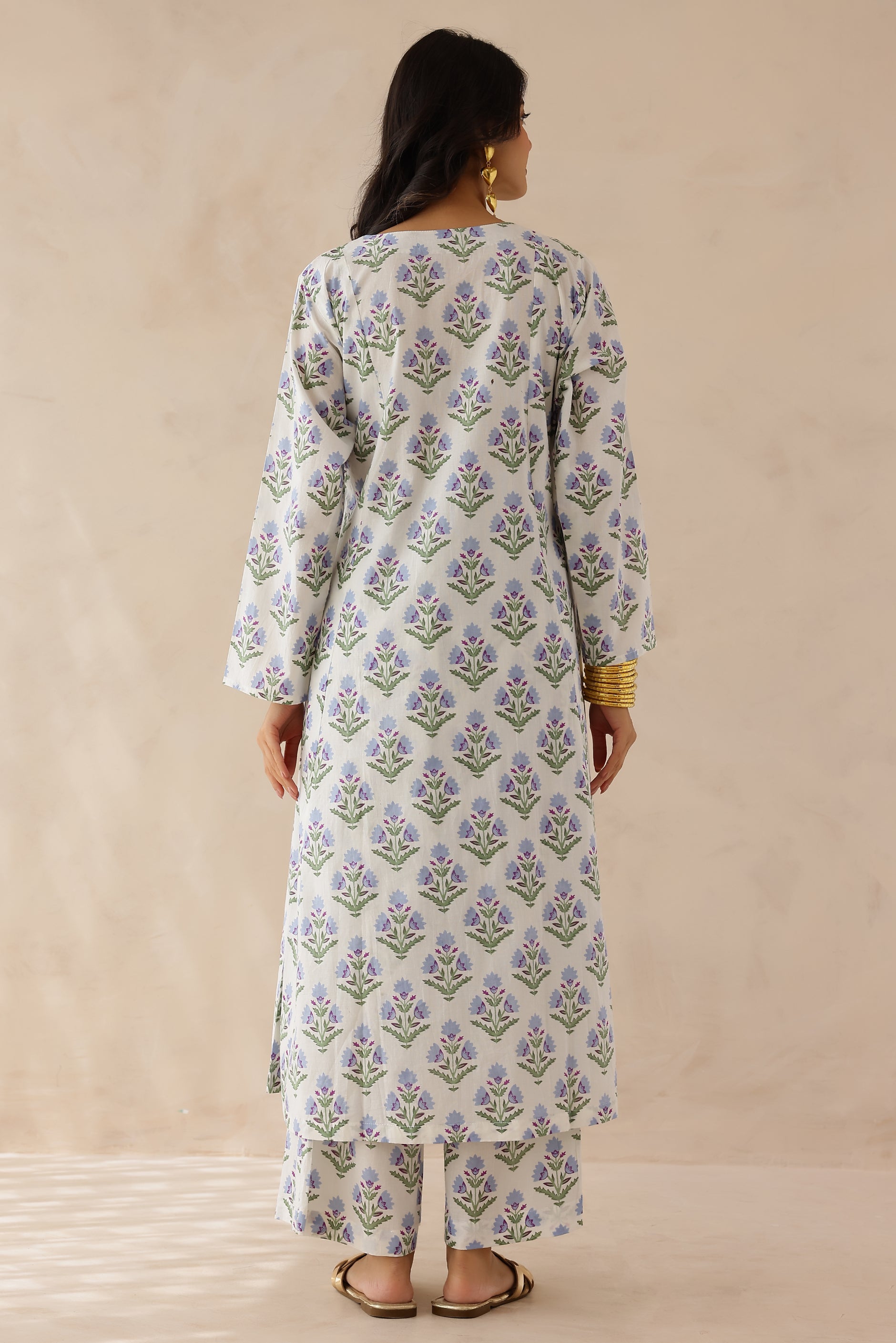 White Blue Printed Cotton Kurta with Palazzo Set of 2 for women featuring all over white and blue prints, round to V neckline, full sleeves, and matching printed palazzo with elastic waist