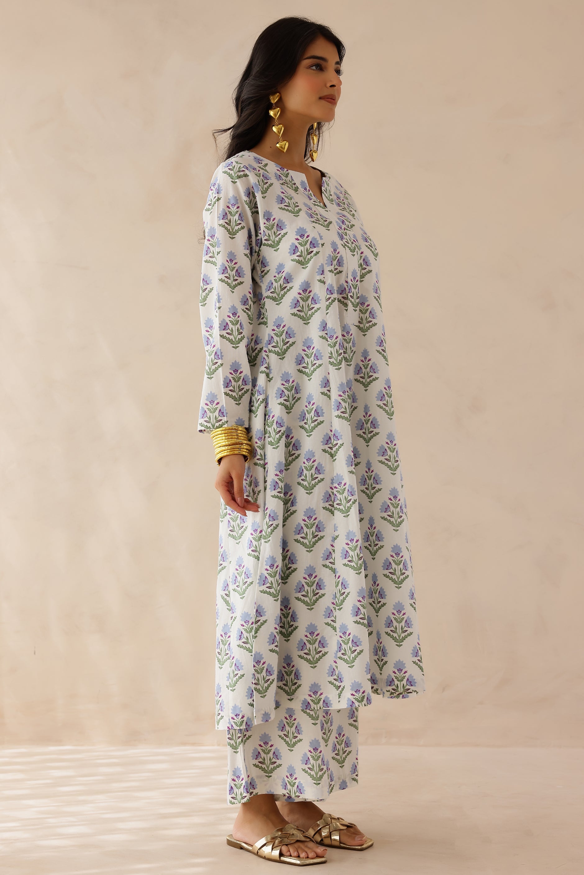 White Blue Printed Cotton Kurta with Palazzo Set of 2 for women featuring all over white and blue prints, round to V neckline, full sleeves, and matching printed palazzo with elastic waist