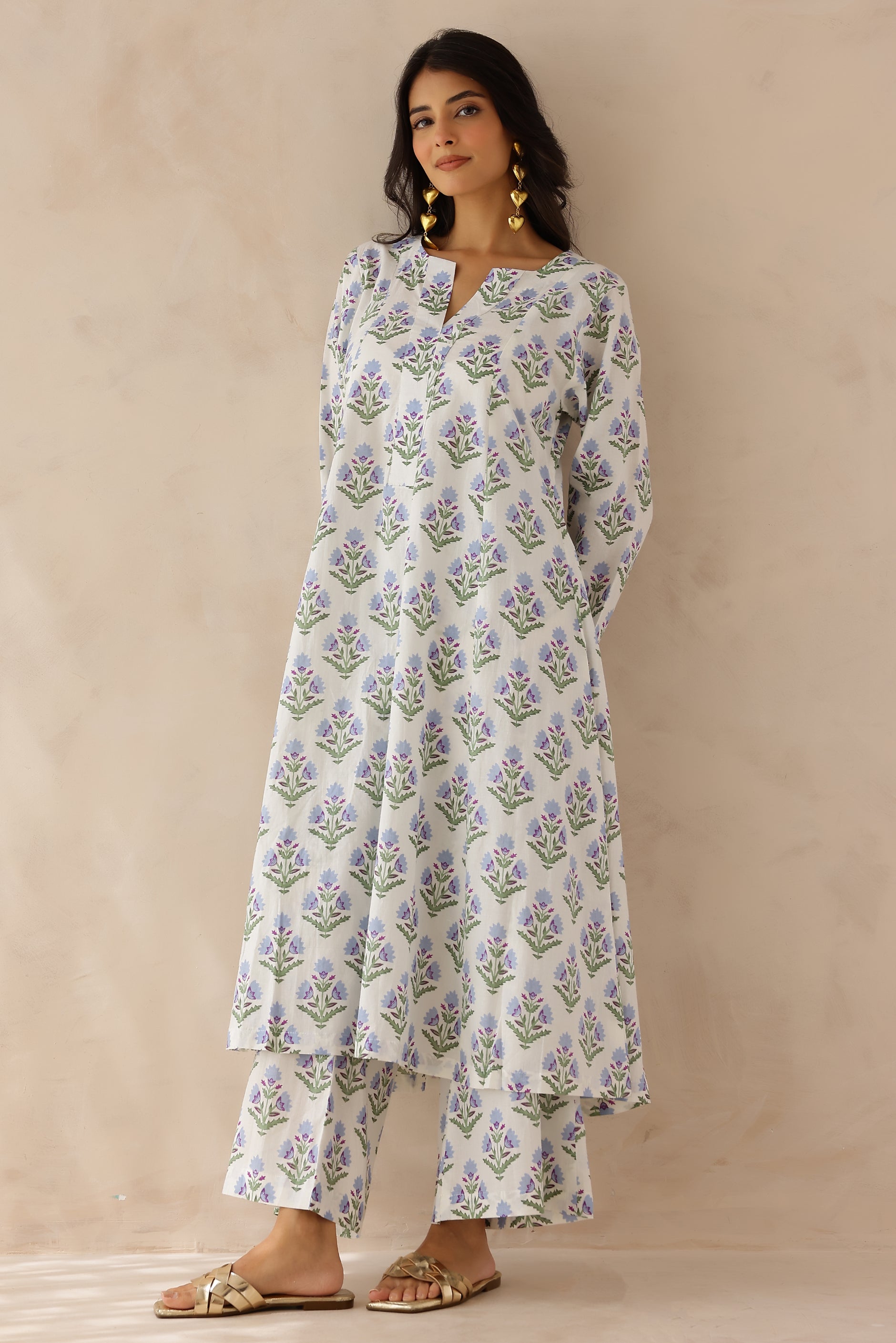White Blue Printed Cotton Kurta with Palazzo Set of 2 for women featuring all over white and blue prints, round to V neckline, full sleeves, and matching printed palazzo with elastic waist