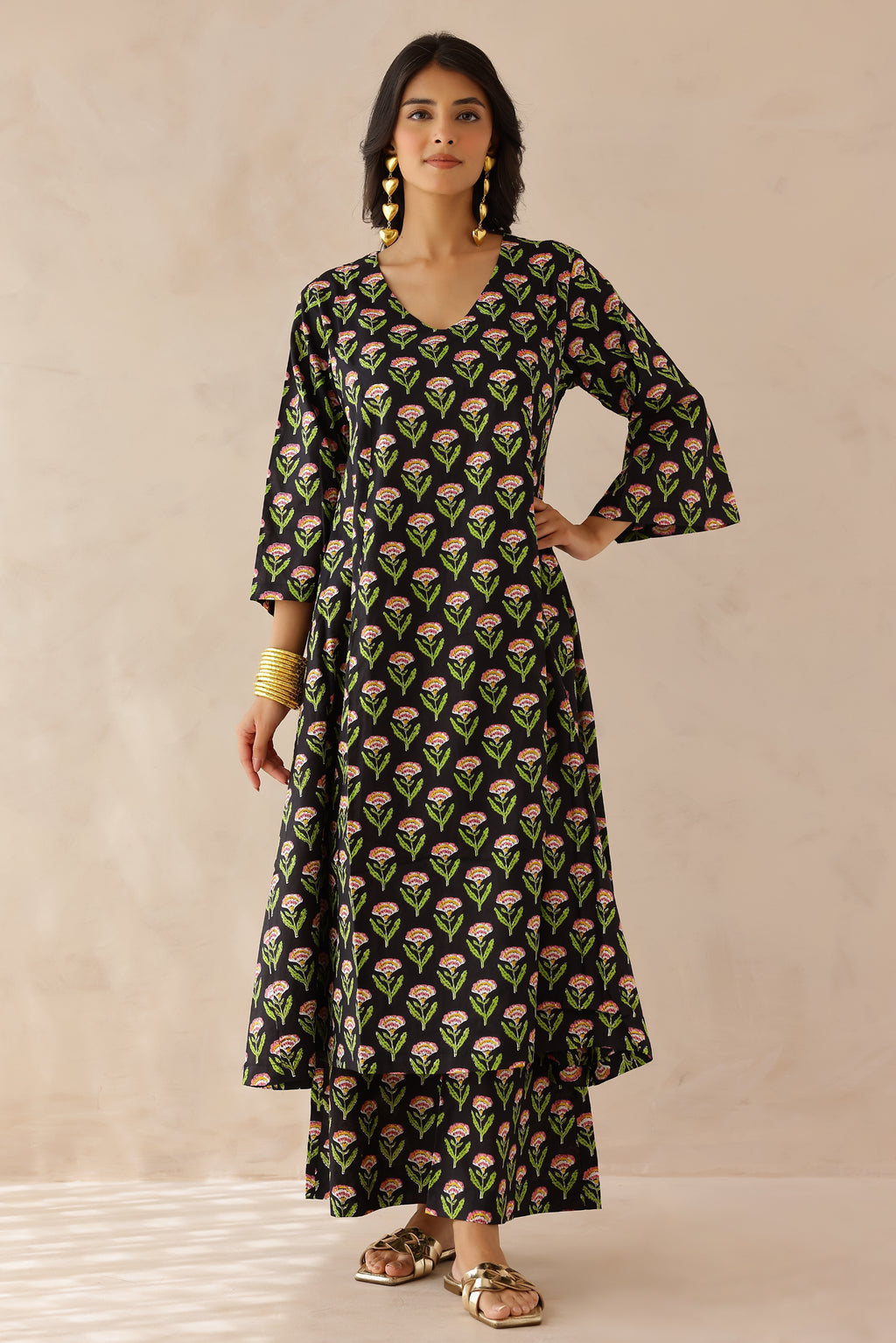 Black Printed Cotton Kurta with Palazzo Set of 2 for women featuring all over black and green prints, V neckline, 3/4th sleeves, and matching printed palazzo with elastic waist