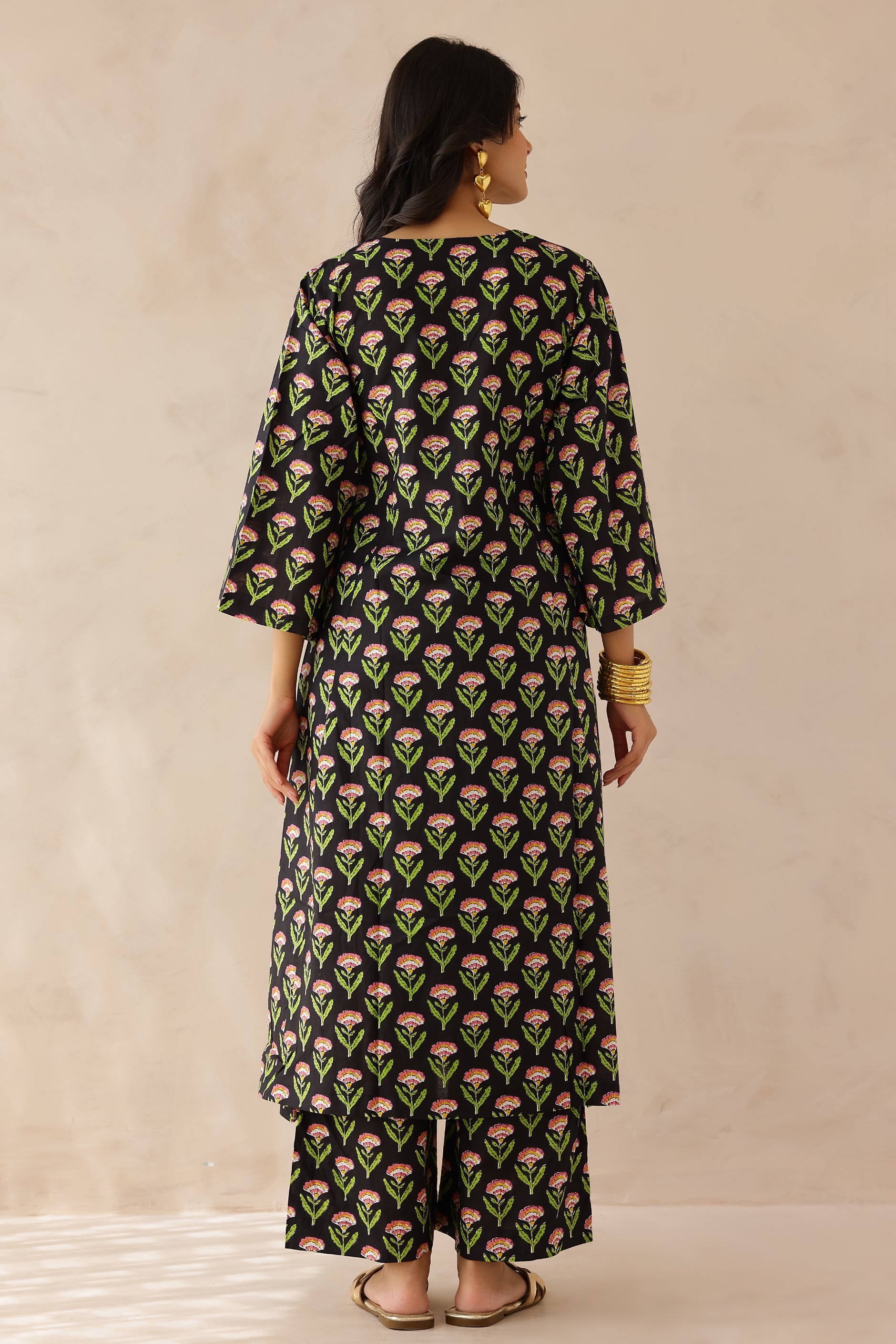 Black Printed Cotton Kurta with Palazzo Set of 2 for women featuring all over black and green prints, V neckline, 3/4th sleeves, and matching printed palazzo with elastic waist