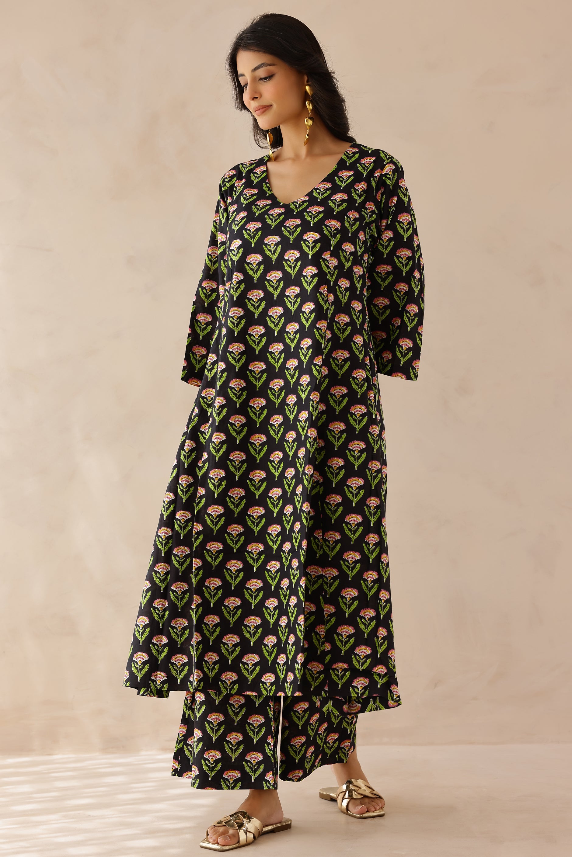 Black Printed Cotton Kurta with Palazzo Set of 2 for women featuring all over black and green prints, V neckline, 3/4th sleeves, and matching printed palazzo with elastic waist