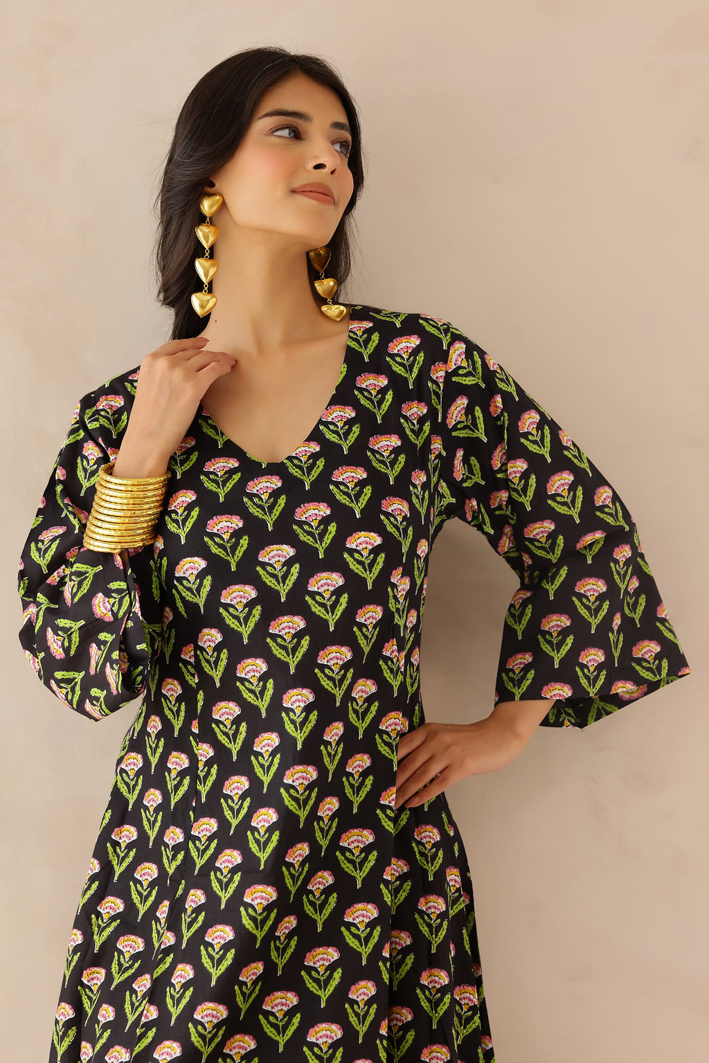 Black Printed Cotton Kurta with Palazzo Set of 2 for women featuring all over black and green prints, V neckline, 3/4th sleeves, and matching printed palazzo with elastic waist