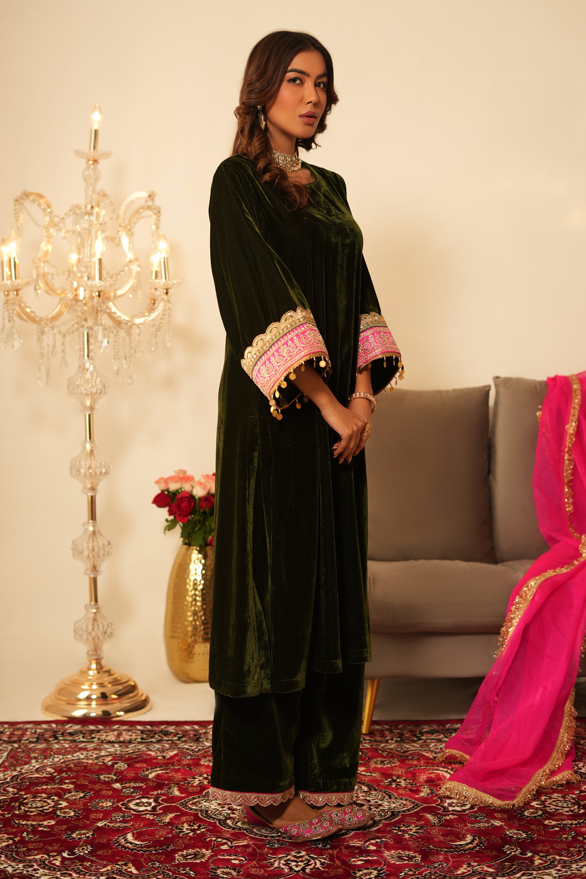 Woman wearing Mehendi Green Gota Lace Velvet Kurta with Pant and contrast organza pink dupatta 