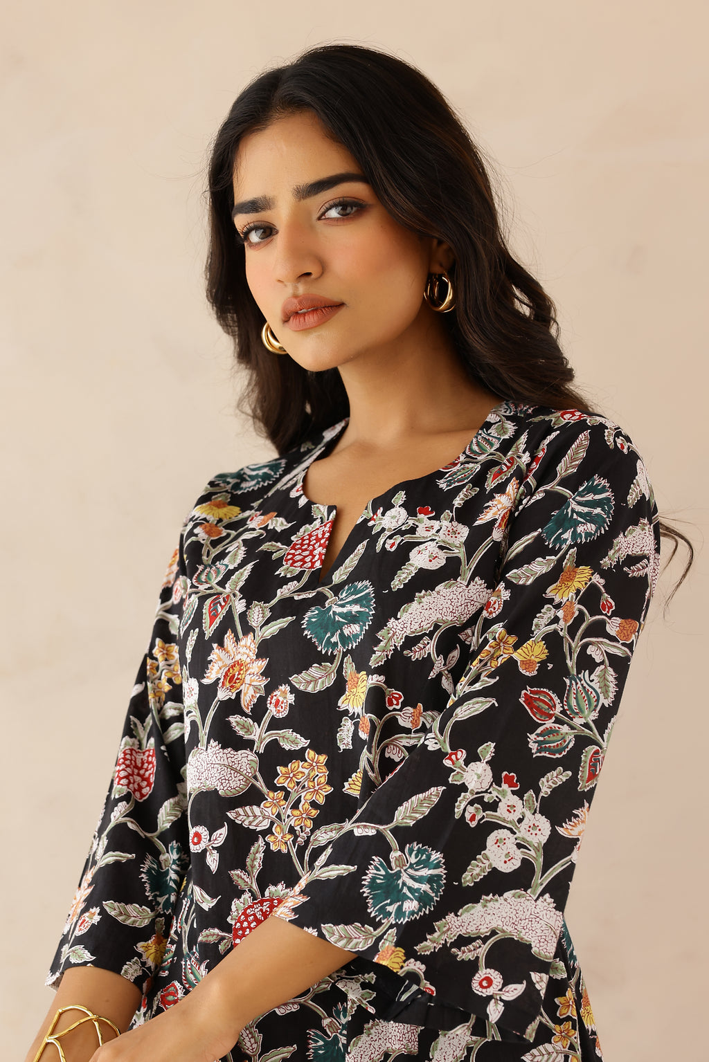 Woman wearing Multicolor Printed Cotton Kurta with Palazzo Set of 2 featuring all over multicolor prints, round to V neckline, 3/4th sleeves